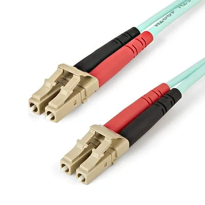 Startech.Com 1m Aqua MM 50/125 OM4 Fiber Optic Cable StarTech.com 1m (3ft) LC/UPC to LC/UPC OM4 Multimode Fiber Optic Cable, 50/125ï¿½m LOMMF/VCSEL Zipcord Fiber, 100G, LSZH Fiber Patch Cord~ - Cable for Network Device, Transceiver - First End: 2 x LC Network - Male - Second End: 2 x LC Network - Male - 100 Gbit/s - Patch Cable - LSZH - 50/125 µm - Aqua